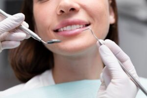 a lady is getting composite bonding treatment