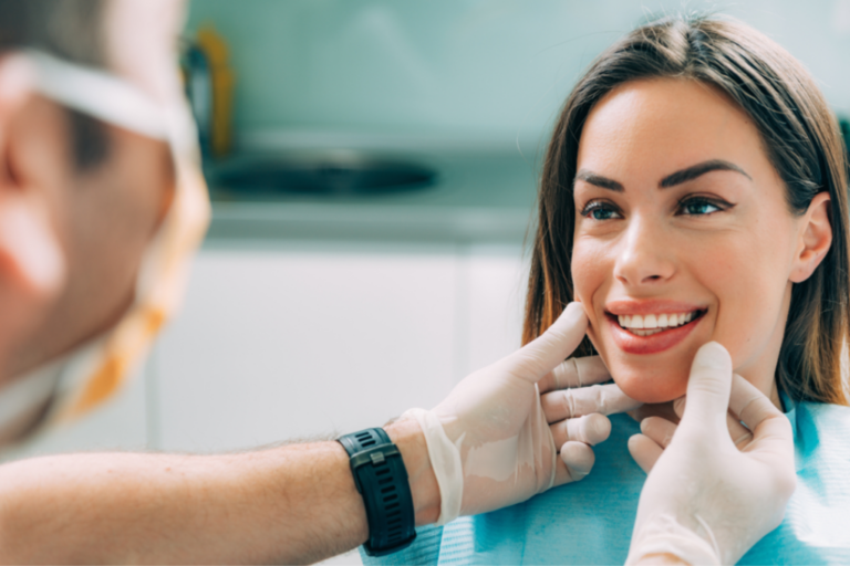 dentist checking patient's teeth for cosmetic dentistry