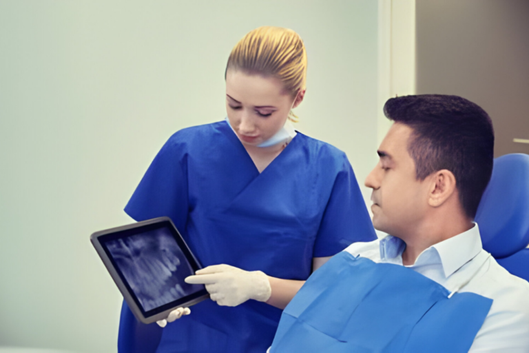 dentist shows a man his dental report