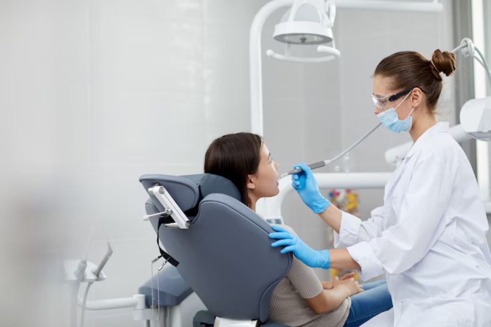 a lady dentist is examine a patient's teeth